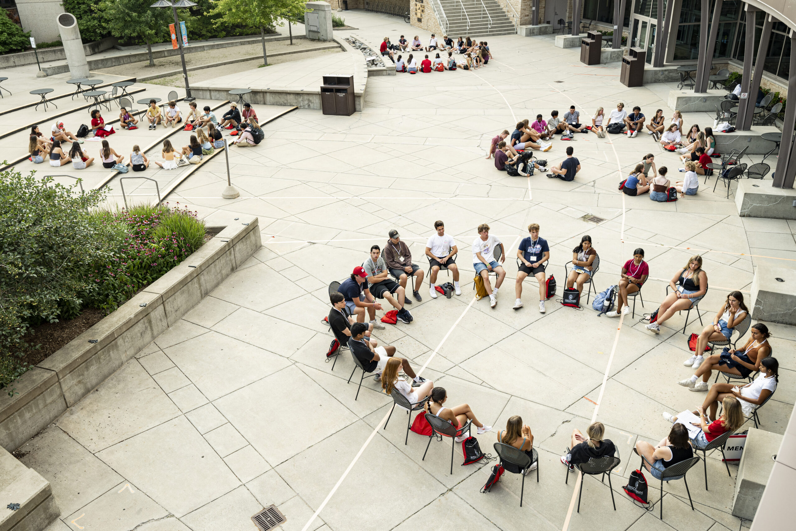 Students gathered outdoors in circles