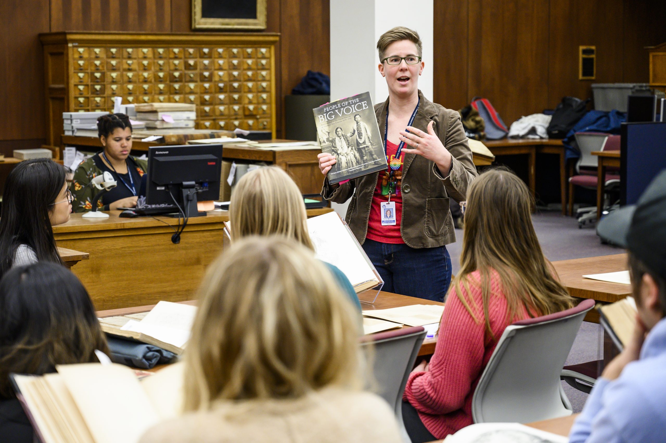 Person presenting a book