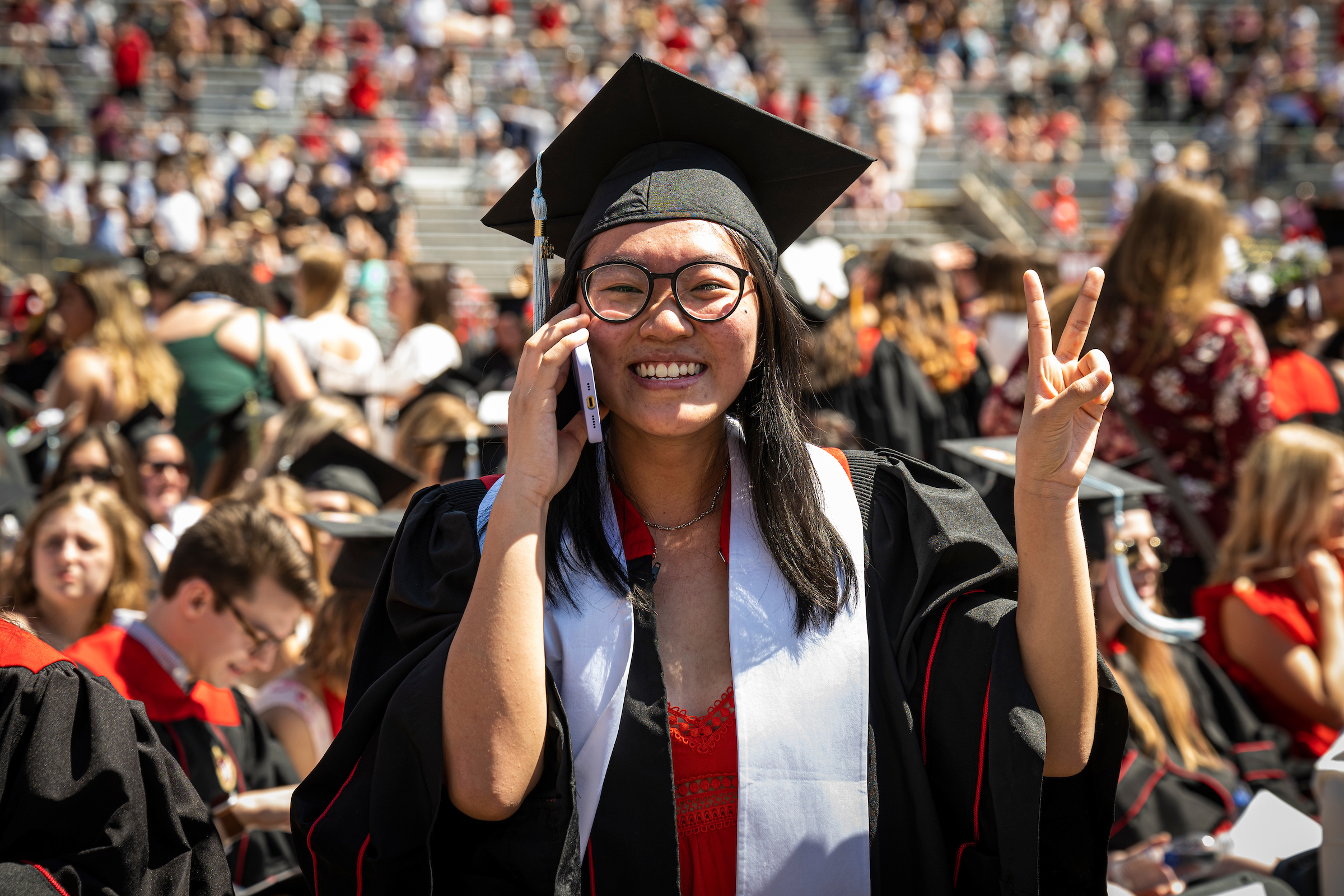 woman at graduation on the phone