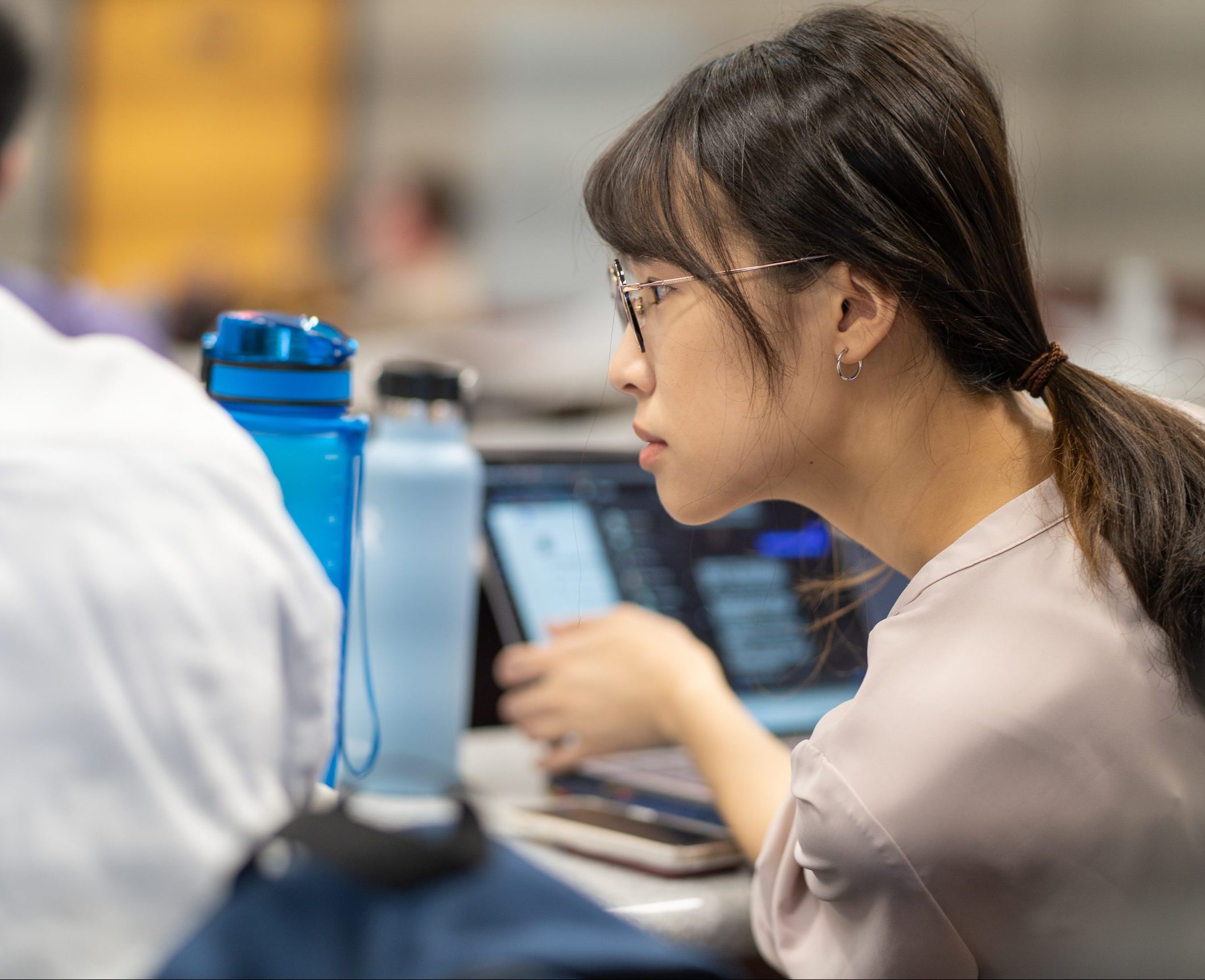 student in class with computer