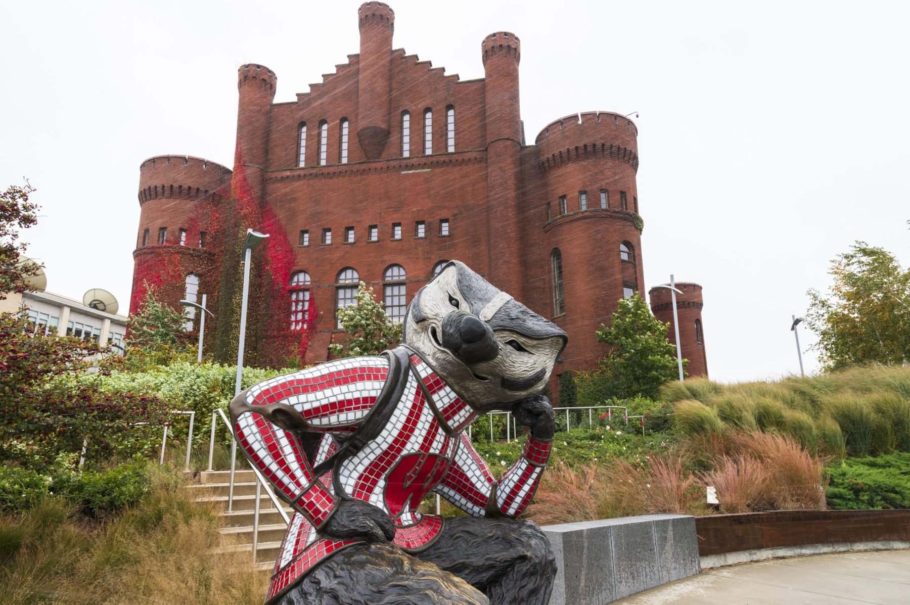 photo of bucky statue with red gym in the background