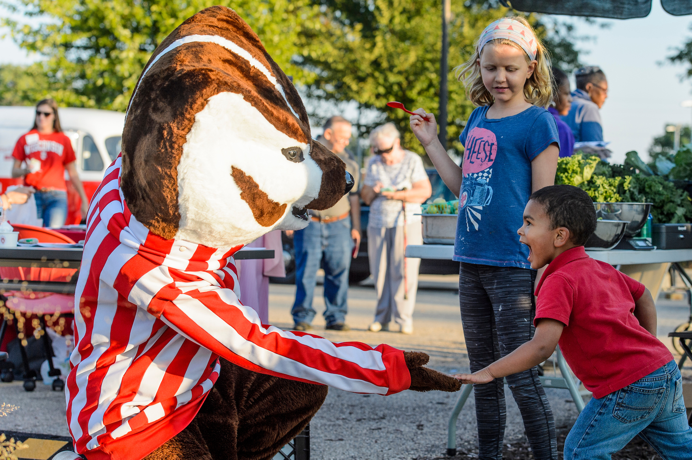 Bucky meeting kids at the South Madison Partnership.