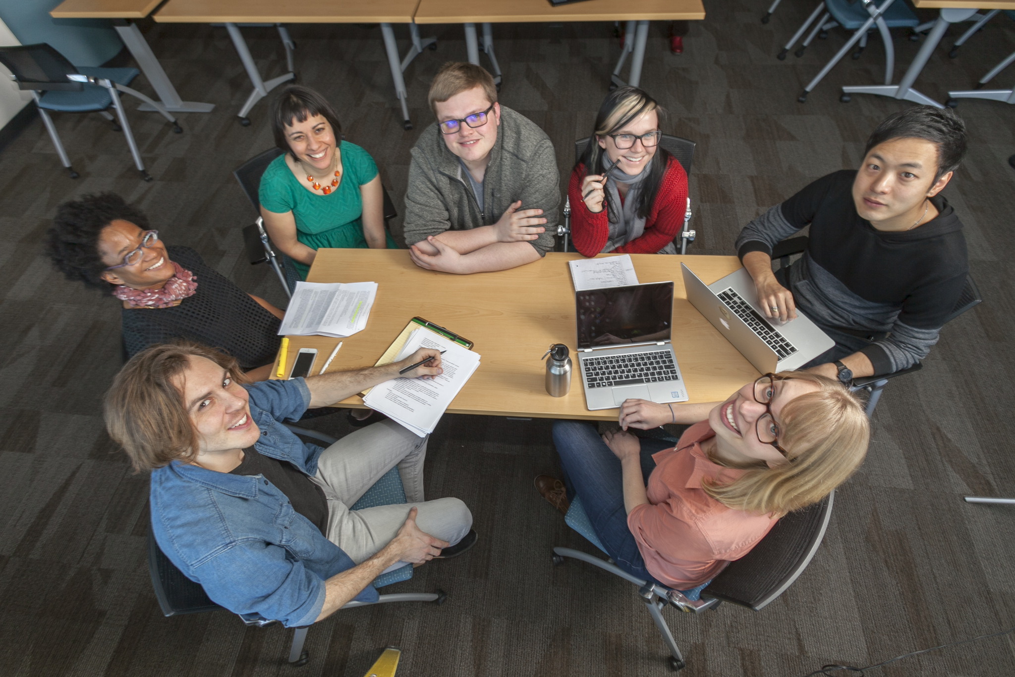 Group of student sitting around a table.