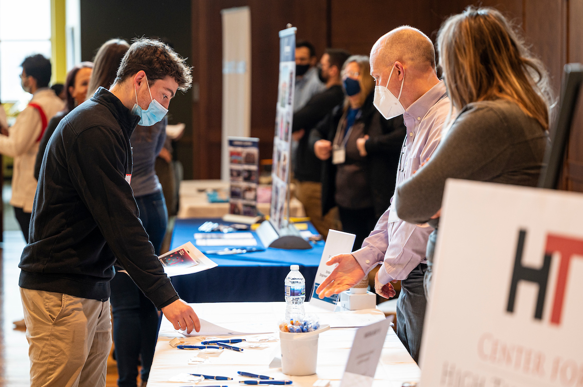 students talking with employers at the CDIS job fair