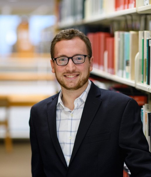 Man in library with glasses