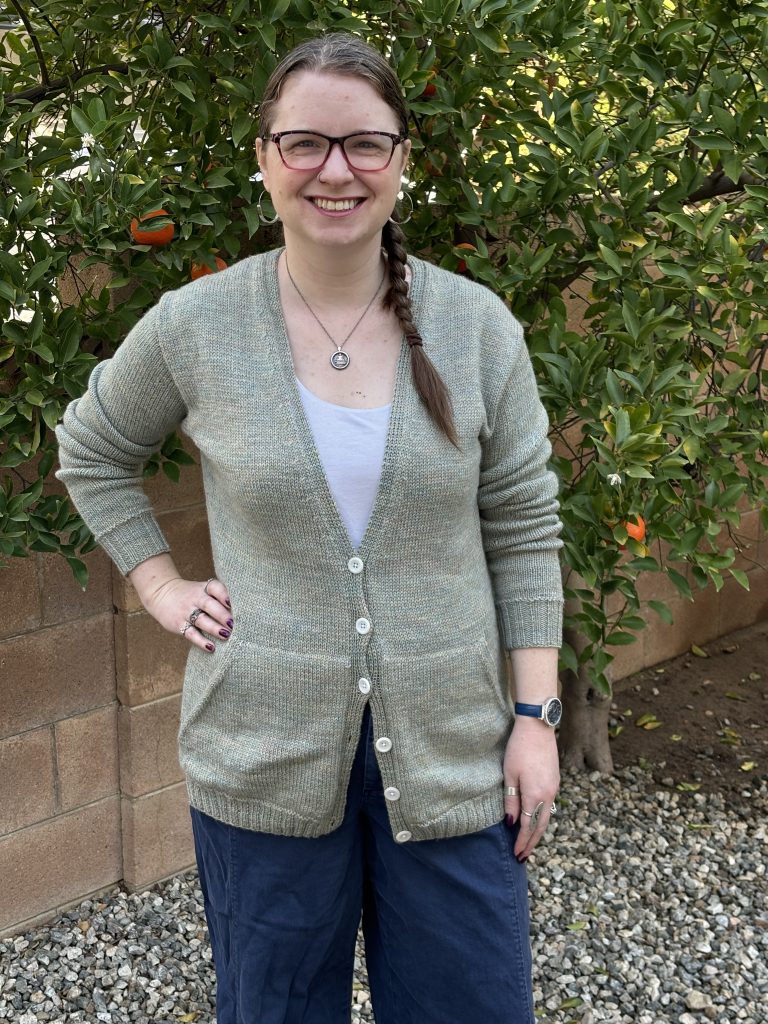 Woman with glasses standing outside