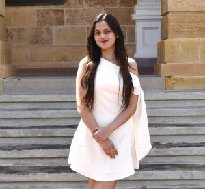 Graduate wearing white dress