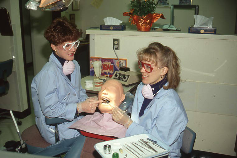Dentistry students practicing on artificial face